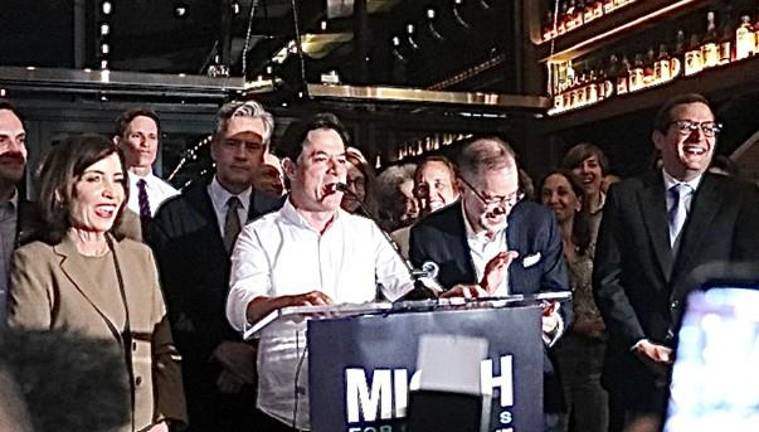 Former City Planning Commissioner Dan Garodnick (at mic) cracks up the crowd as Gov. Kathy Hochul (left) Comptroller Mark Levine (right of speaker) and Borough president Brad Hoylman-Sigal (rear) look on with Lasher in the far right.