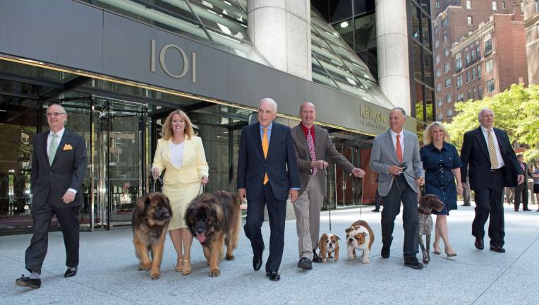 Developer Peter Kalikow (center left) in front of his building at 101 Park Avenue, which will be the new home of the American Kennel Club and its Museum of the Dog. At far left is AKC President and CEO Dennis Sprung, with AKC executives, dog owners, dog handlers, and of course, dogs. Photo: Nancy Epstein / H.J. Kalikow &amp; Co. LLC
