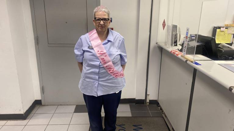 Angie Serrano on her last day with a crown and a sash to celebrate her last day on April 30.