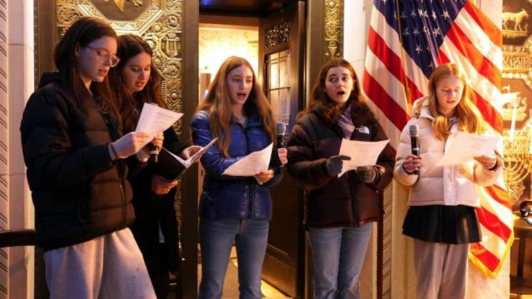 Carolers singing during a December 7 menorah lighting at Temple Emanu-El, a Reform synagogue on the UES.