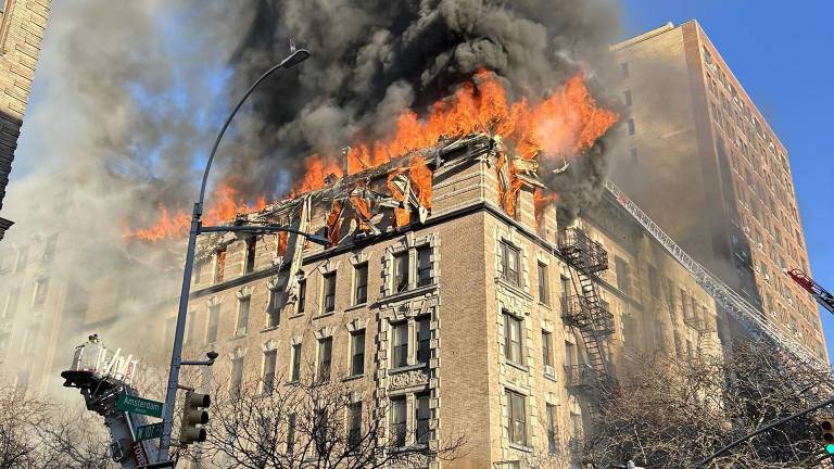 A four-alarm blaze essentially melted the roof off of 201 W. 107th St. on Dec. 9, although no serious injuries were reported.