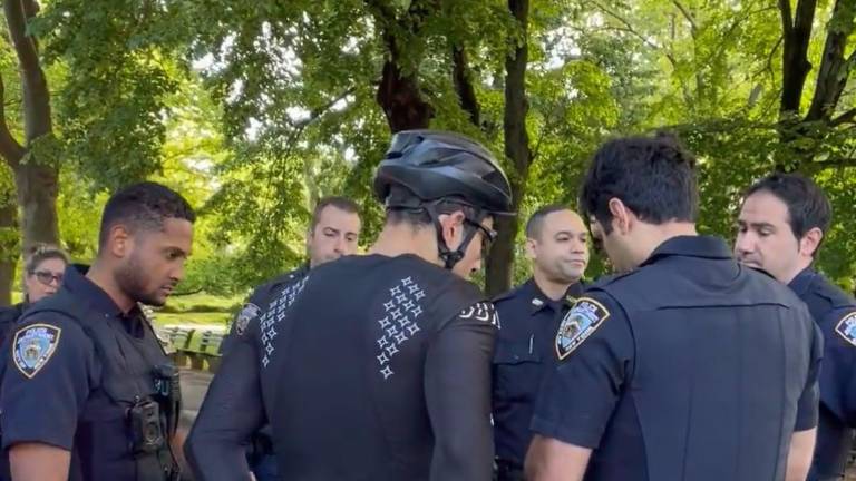This biker (center) was collared by police at 7:30am in Central Park on May 10 because he refused to stop immediately when ordered to, according to a post on the subreddit site r/nycbike. The post said that the biker was eventually let off with a “violation.”
