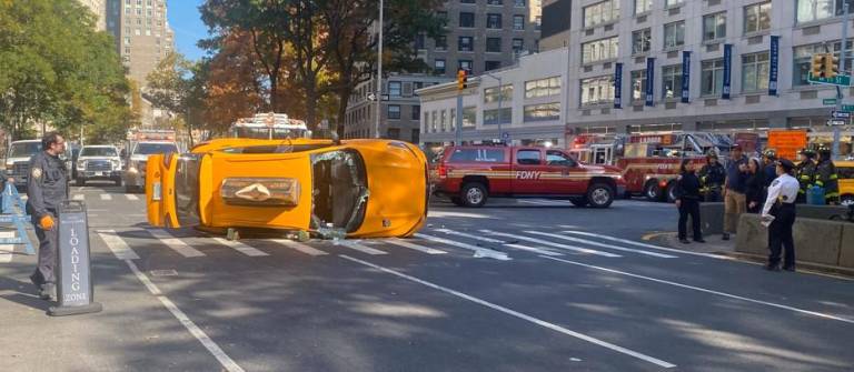 A taxicab flipped over onto its side near W. 77th and Broadway on Oct. 22, the FDNY and NYPD confirmed to <i>The Spirit</i>. A 77 year-old was taken to Cornell Medical for treatment, although it’s unclear whether he the cab’s passenger or driver as of press time.