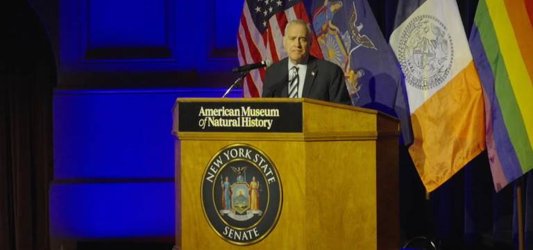 New York State Comptroller Thomas DiNapoli speaking at State Senator Erik Bottcher’s inauguration ceremony at the AMNH.