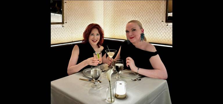 Karen Rempel and fashion designer Andrea Thurlow are happy diners.