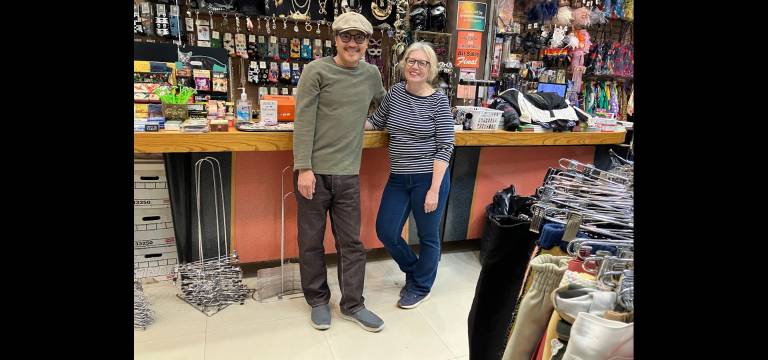 Window dresser Rodney Rufo and store manager Joan Bedor take a break for a chat at Reminiscence on Fifth Avenue.