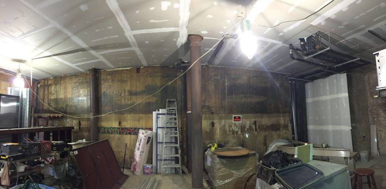 A mural, thought to date to the 1920s or 1930s, was uncovered during renovations at the new location of Bella Luna on Columbus Avenue. Photo: Silas White