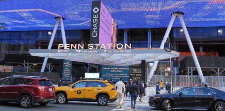 <b>The new Penn Station entrance on Seventh Ave between 31st and 33rd St. allows more light into the concourse below and features an ADA accesible elevator and three new escalators as it re-opens after a 15 month shut down while construction was underway.</b> Photo: Ralph Spielman