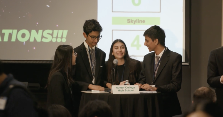 Members of Hunter College High School’s economics team celebrate after winning the National Economics Challenge Quiz Bowl in Atlanta.