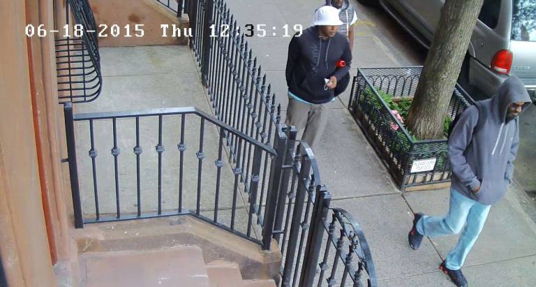 Police are looking to question these three men in connection with the killing of an Amsterdam Avenue storekeeper on Thursday afternoon. The three are pictured in surveillance footage taken around the time of the incident. Photo: New York Police Department.