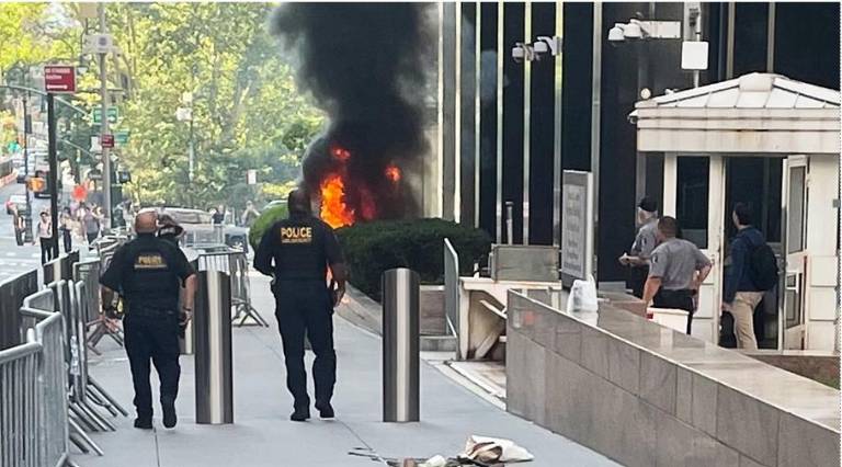 Black smoke and flames erupted in front of 26 Federal Plaza in lower Manhattan on the morning of July 20 after Army veteran Andrew Arrabaca set fire to a staircase.