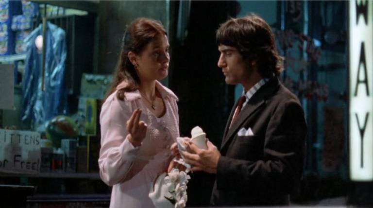 Leigh Taylor Young offers De Niro a subay token to Italian ice eating De Niro in <i>The Gang Who Couldn’t Shoot Straight </i>(1971).