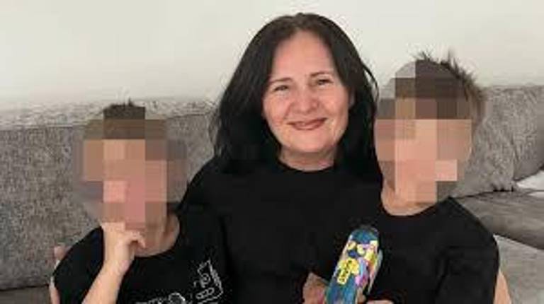 Donike Gocaj, above with two of her grandchildren. She died in a freak accident when she fell down an uncovered manhole on May 18 after stepping out of the front door of her parked car.