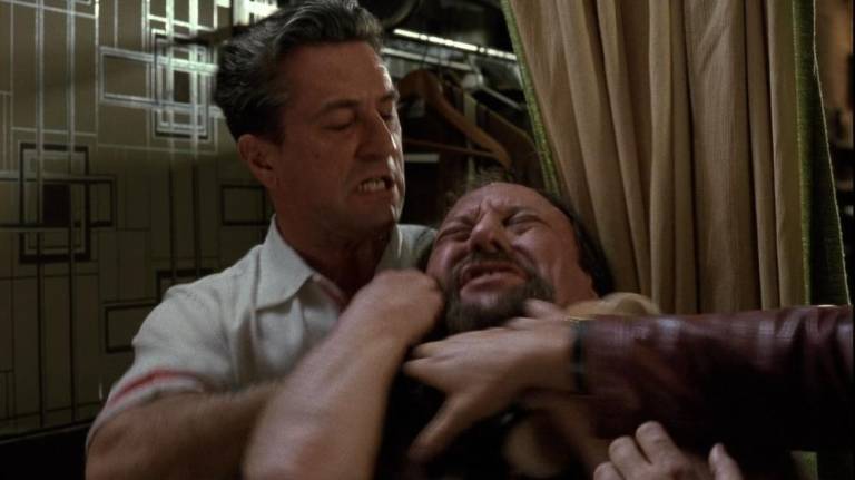 De Niro as Jimmy Conway in <i>Goodfellas</i> (1990) strangles Morrie, of Morrie’s Wigs, as Ray Liotta (Henry Hill) tries to intervene.