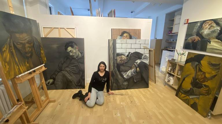 Zhenya Gershman surrounded by her paintings