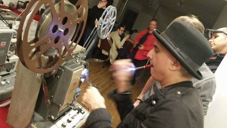 Denny Daniel uses ageless 16 mm projectors to play vintage shorts films from the early 1900s to the 1970's. Photo: Esti Grifel