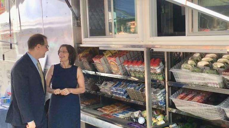 Council Members Helen Rosenthal and Mark Levine check out&#160;WSCAH's new mobile pantry, which serves clients at Levine's office in Harlem. Photo: Leslie Gersing