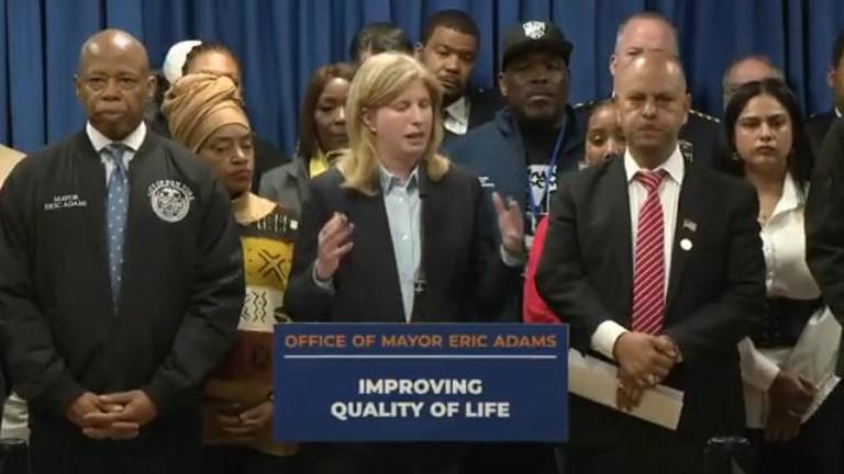 NYPD Commissioner Jessica Tisch (center) and NYC Mayor Eric Adams (left) unveiled the Quality of Life division during an April 10 kickoff at the 13th Pct. on the East Side. Francisco Marte (front row right), president of the Bodega and Small Business Group praised the new pilot program.