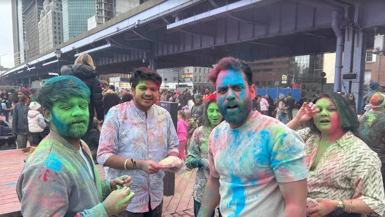 Hair, faces and clothes all covered with powder at the March 7 celebration of the Holi Festival at the South Street Seaport.