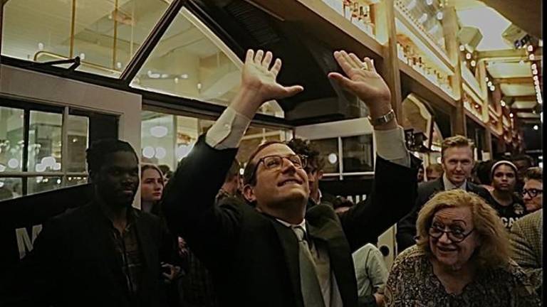 Micah Lasher throws his arms up in celebration.