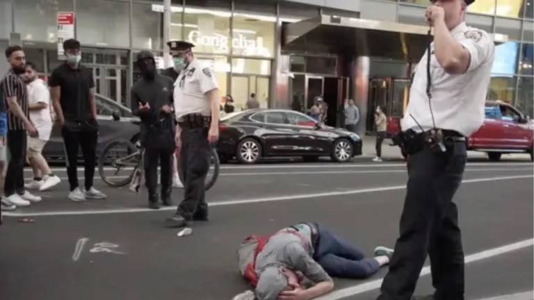 A victim on the ground after Times Square melee of May 20, 2021.