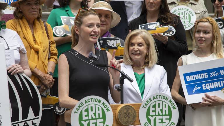 Virginia Maloney, Council Member and daughter of former Representative Carolyn Maloney, speaks on the steps of City Hall. “As we prepare to celebrate our country’s 250th anniversary, what message do we send to future generations if women’s rights remain vulnerable to political winds?” Maloney asked.