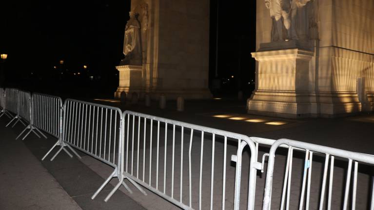 How to handle the opening around the arch is an entirely different challenge. Currently, closing the space requires around a dozen of the barricades linked together.