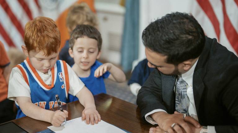 Along with Mamdani signing the order, the mayor invited kids to stamp their handprint and draw on the executive order during a press conference June 1. (Credit: NYC Mayor)