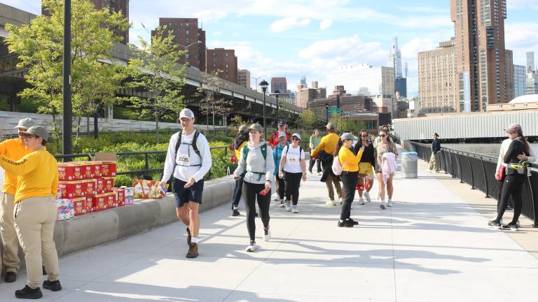 Volunteers hand out snacks to help participants refuel along the 32-mile route of the Great Saunter around Manhattan.