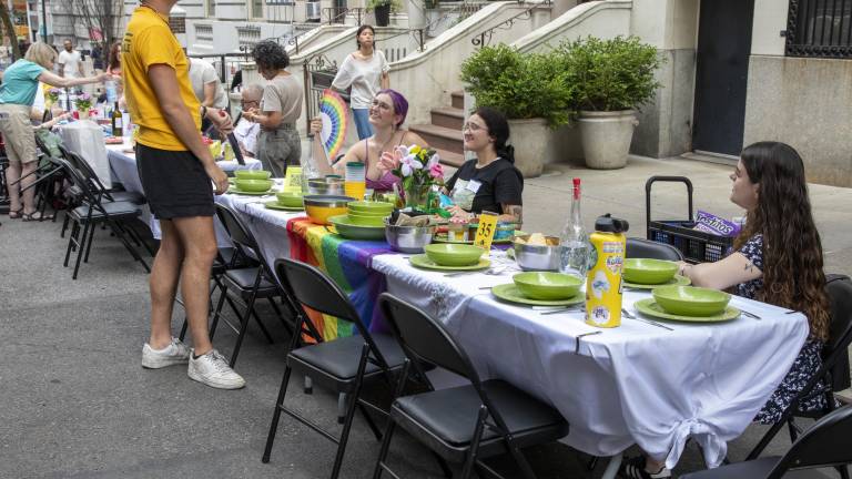 Neighbors brought a huge array of dishes, silverware, and table decorations to the event, sharing food from a variety of cuisines.