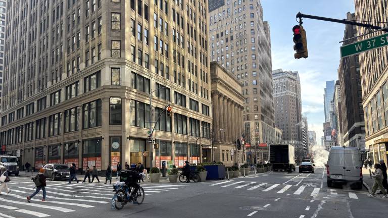 E-bikers such as the one above on Seventh Ave. last week, were routinely ignoring red lights even before Mayor Mamdani took away the criminal summons penalty for bike traffic infractions. The relaxed standards take hold on March 27.