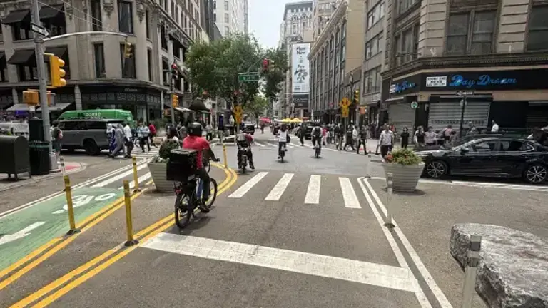 E-Bikes going through red light at Broadway and West 25th Street.