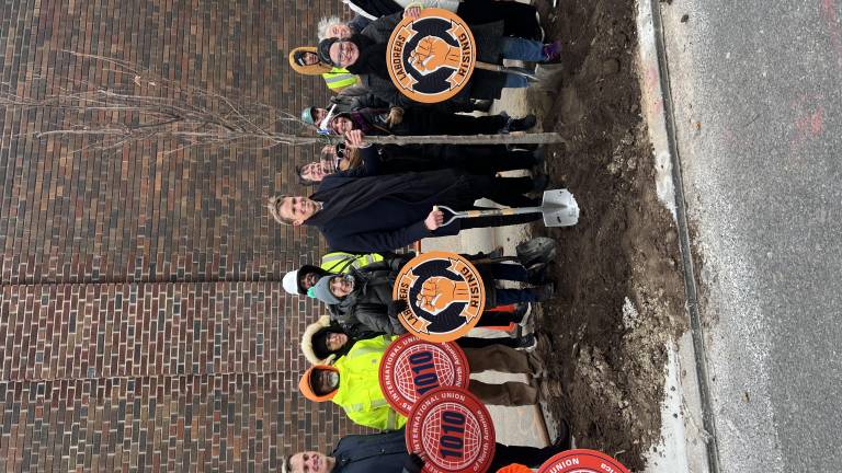 City Council Member Erik Bottcher (center) poses with a sapling, the 1,000th he’s planted locally during his time representing Chelsea and Hell’s Kitchen. He was joined by local laborers, allies, and Parks Dept. reps.