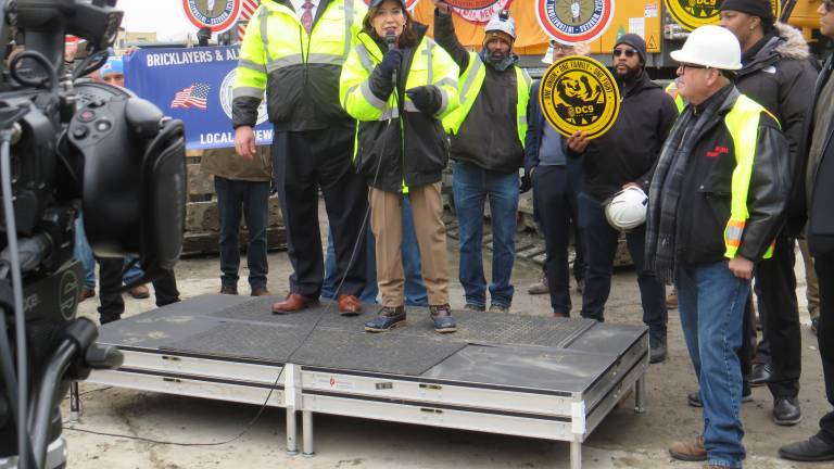 With union chief Gary LaBarbara looking on, Governor Kathy Hochul on Feb. 17 spoke of her families strong union ties at a rally with more than 150 Gateway workers held at the NYC Gateway Tunnel job site entrance near the Hudson River.