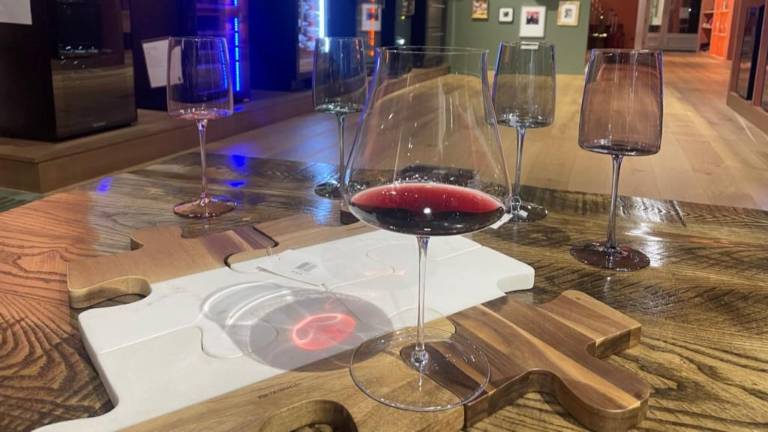 The retail store does not sell bottles of wine, but customers can enjoy a sample while trying out glassware.