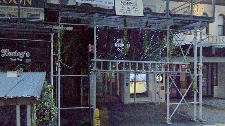 La Mararena Restaurant &amp; Sports Bar under scaffolding, Sep. 2024. The bar owners stiffed workers to the tune of over $280,000 in wages over nearly three and a half years, prosecutors charged.