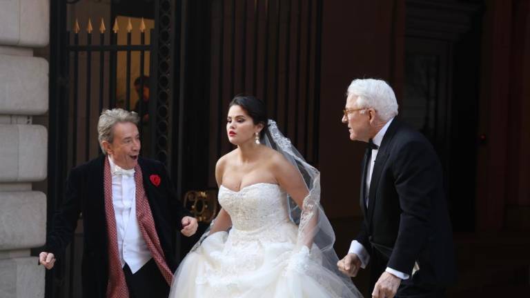 In a possible hint of what is in store for the next season of Hulu’s hit “Only Murders in the Building,” Selena Gomez, who plays Mable Mora, is captured by paparazzi in a stunning wedding dress as she exits the fictional Arconia Building on W. 86th and Broadway. Photo: Steve Sands/New York Newswire