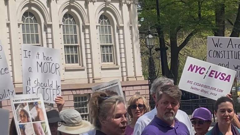 Janet Schroeder, who leads the Electric Vehicle Safety Alliance, rallied outside City Hall on April 16 for the passage of Priscilla’s Law. It would force the registration of e-bikes and other e-vehicles.