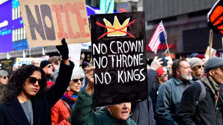 Handwritten signs proclaiming “No Ice” and “No Kings” were in abundance, as were American flags, some flying upside down in a symbol of international distress.