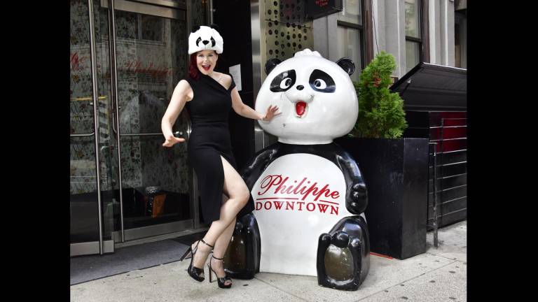 Karen Rempel plays with Philippe Chow’s panda.